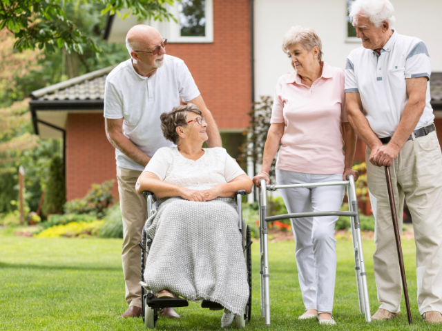 Senior citizens in front of seniors housing